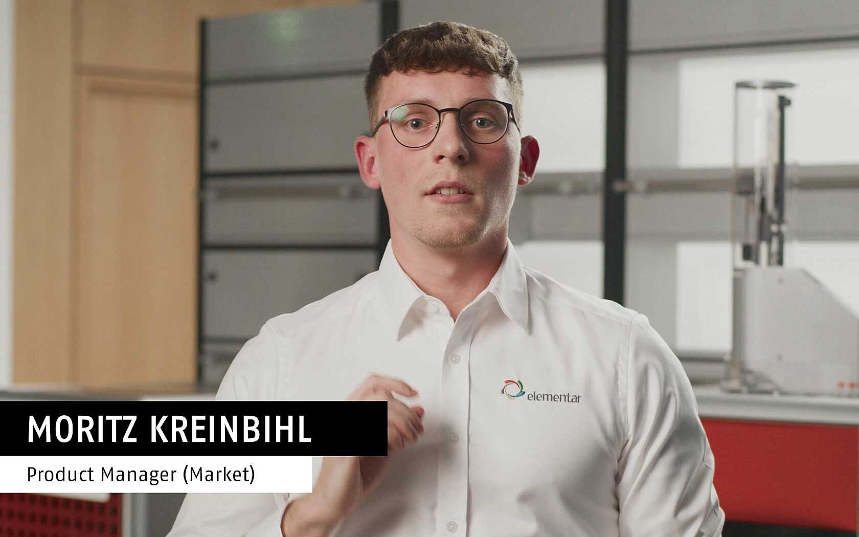Man standing in front of an oxygen analyzer in the lab