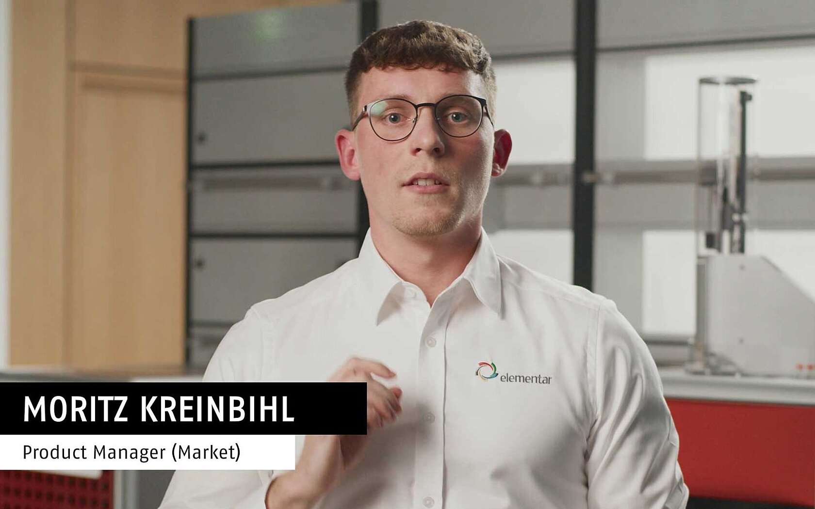 Man standing in front of an oxygen analyzer in the lab
