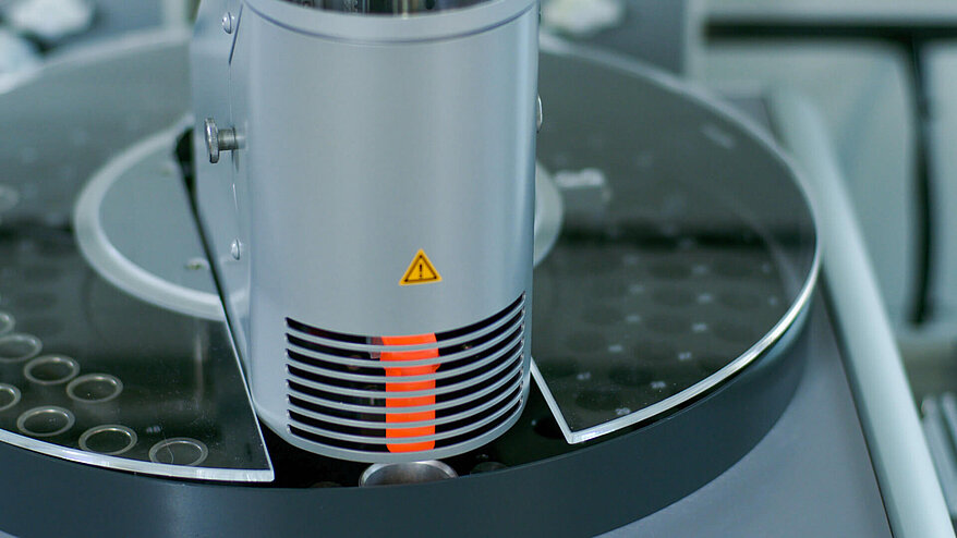 Gripper arm with crucible of the rapid MAX N exceed nitrogen and protein analyzer