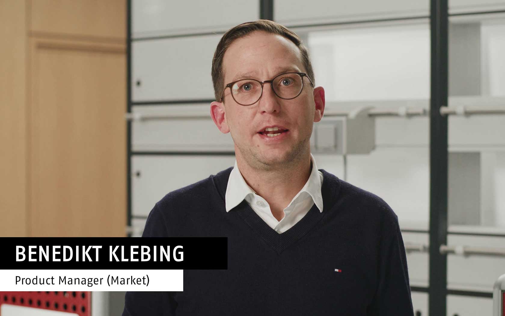 Man standing in front of an elemental analyzer in the lab