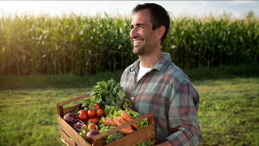 Farmer with organic vegetables in the field